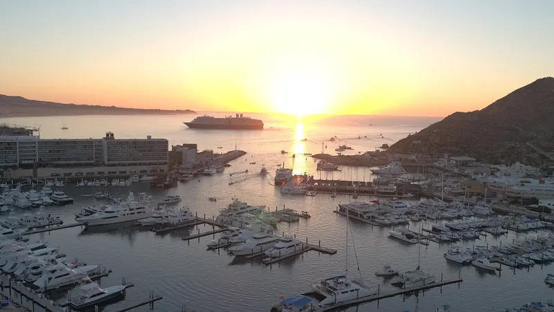 Marina Cabo San Lucas at sunrise, with a cruise ship on the bay
