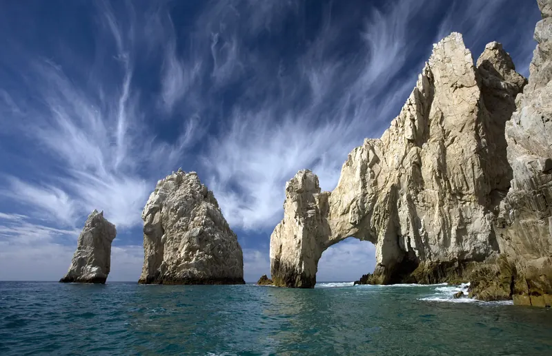 El Arco and the pinnacles of Land's End under a streaked sky, Cabo San Lucas