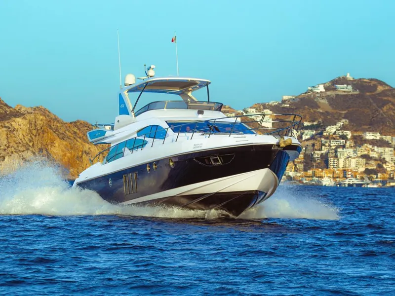 Azimut 70 under way with the Cabo San Lucas hillside behind