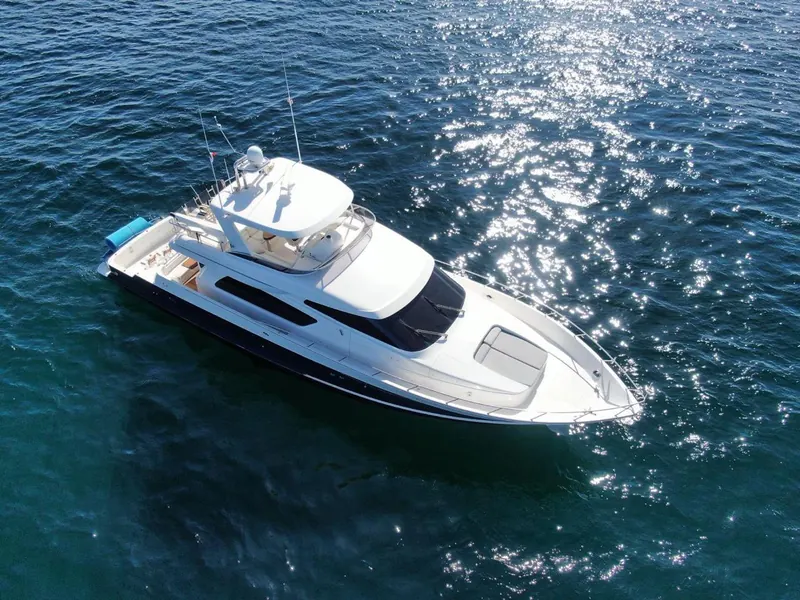 McKinna 70 seen from above on dark blue water with sunlight on the surface