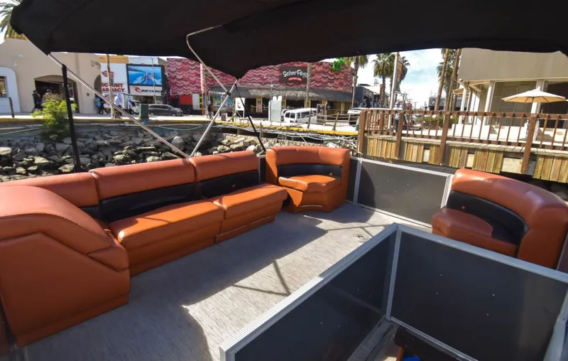 Wraparound lounge seating under the bimini top on the Pontoon 38 in Marina Cabo San Lucas