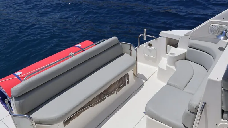 Aft bench seating facing the water on the Regal 45