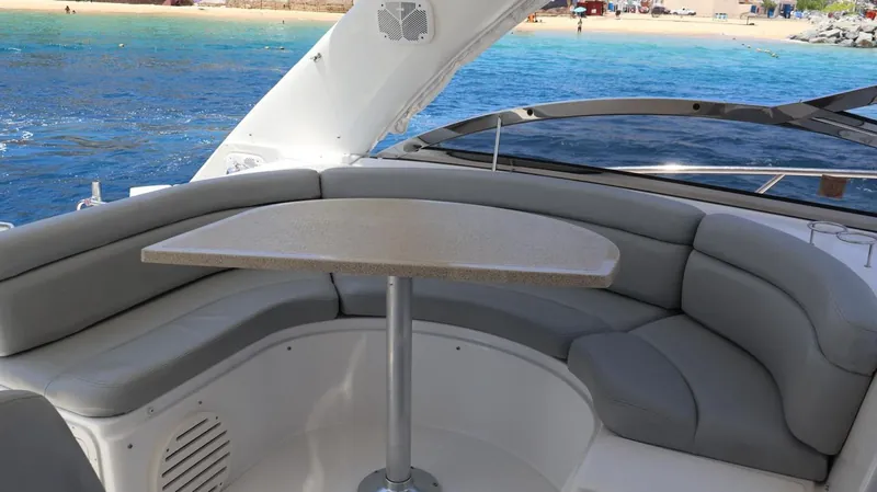 U-shaped cockpit dining with table on the Regal 45