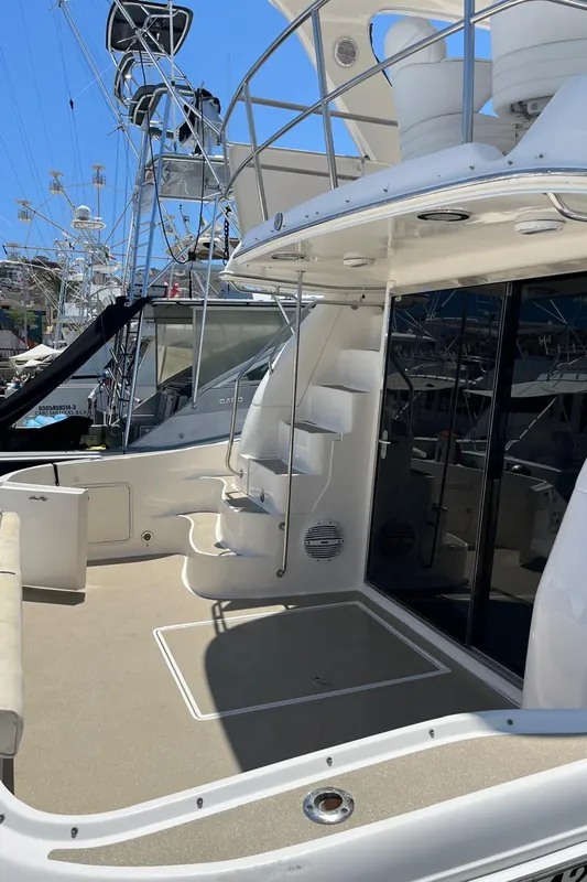 Aft deck of the Sea Ray 55 at Marina Cabo San Lucas, with the stairs to the flybridge