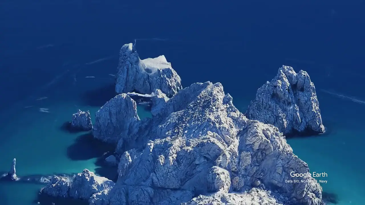 Aerial view of the Arch at Land's End and the open water beyond it